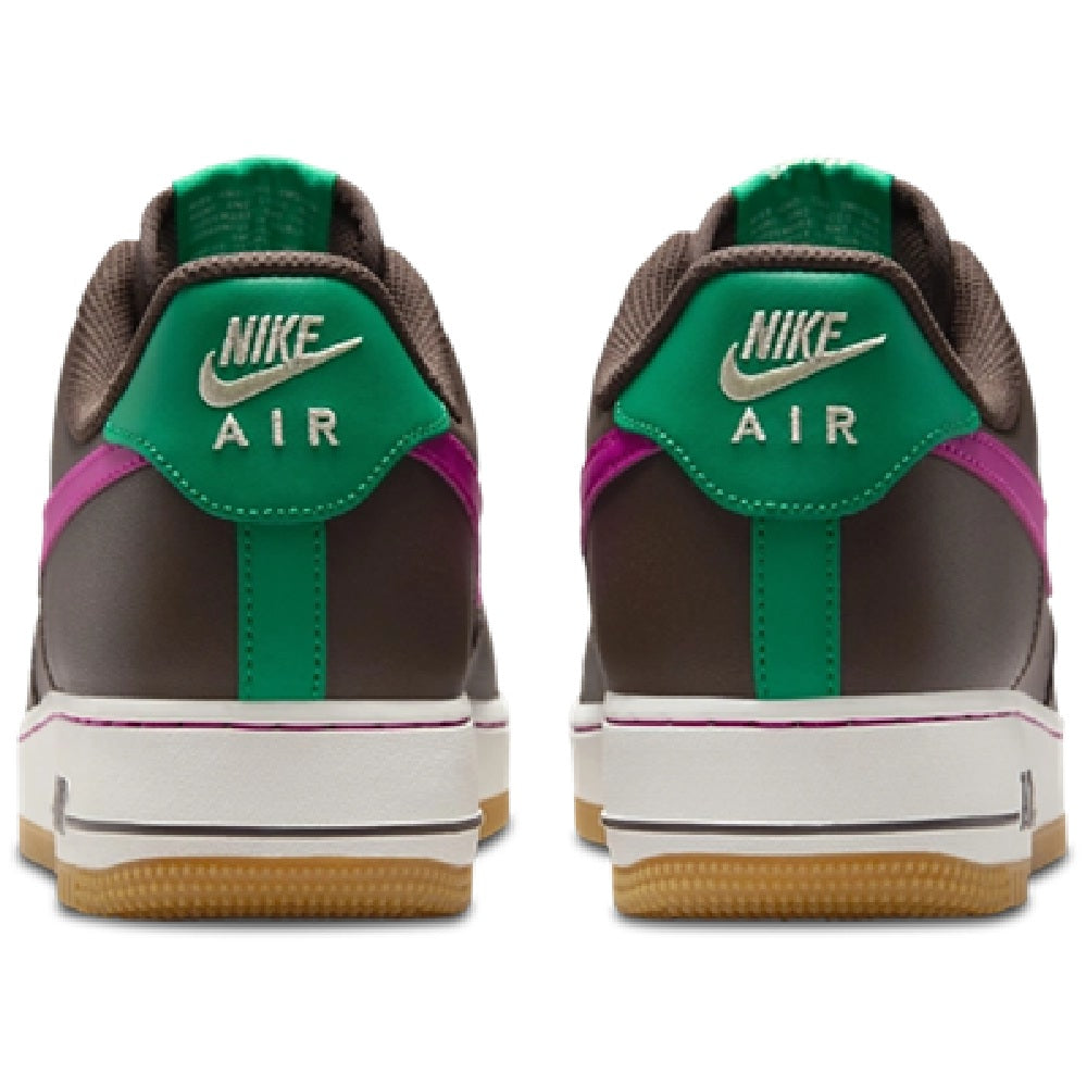 Back view sneakers with green Nike Air heel panel, white midsole, gum outsole