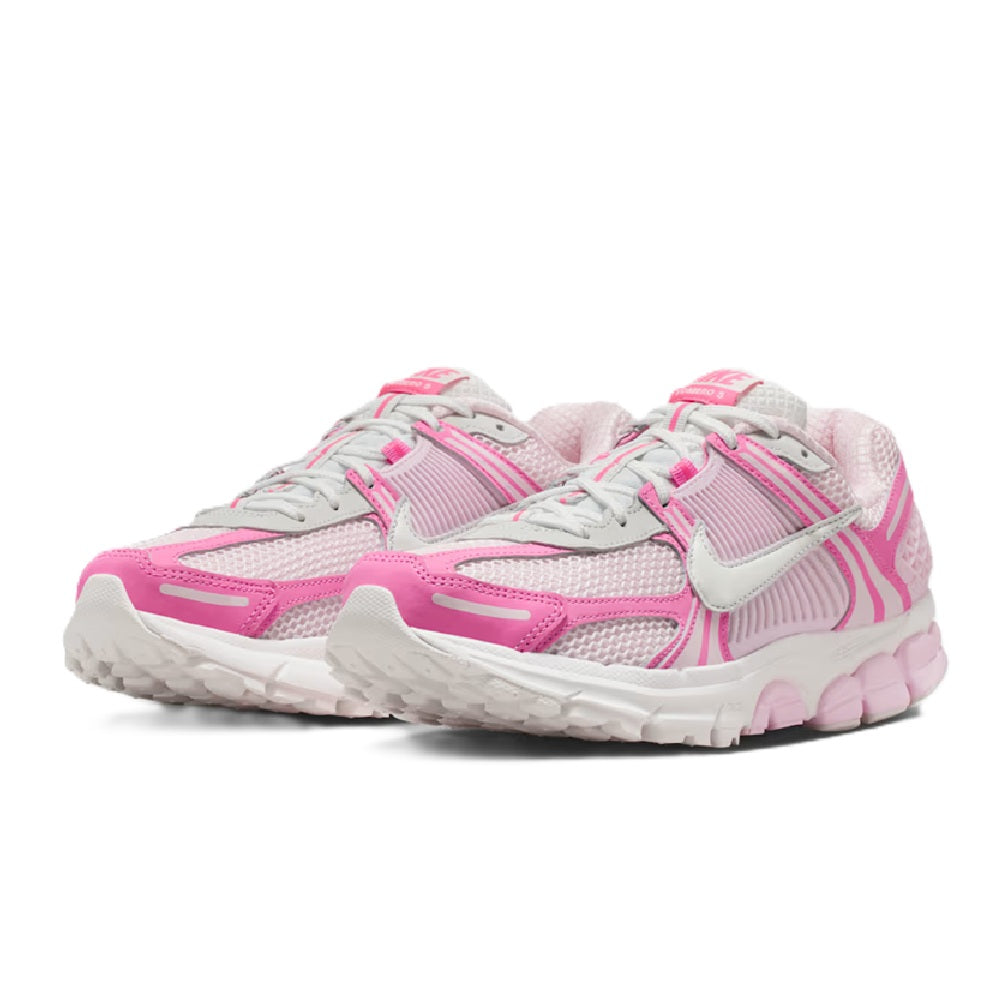 Women's Nike Zoom Vomero 5 sneakers, two-shoe view with pink laces and swoosh.