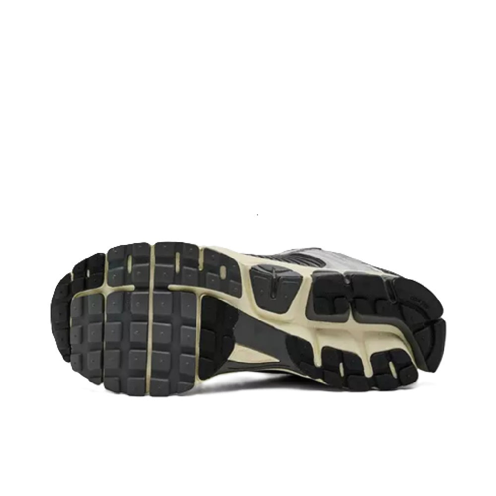 Men's running shoes outsole view with deep tread and gray upper