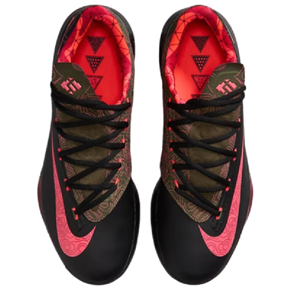 Pair of black lace-up shoes showing red interior lining and patterned tongue