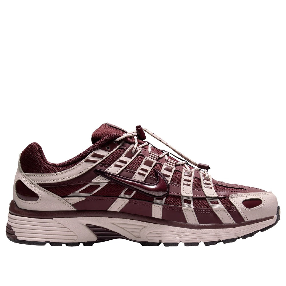 Women's Nike P-6000 running sneakers in burgundy and light gray, lace-up design