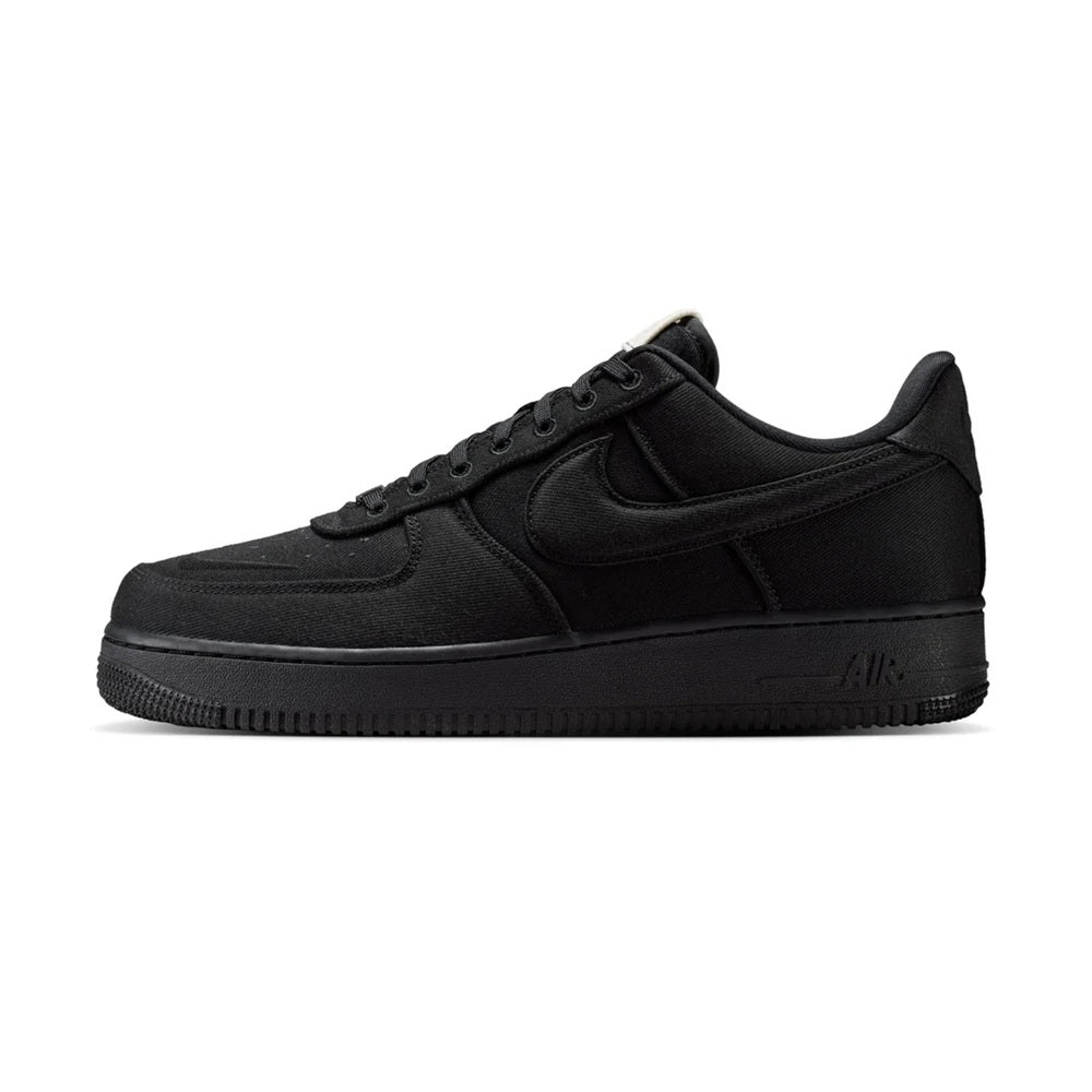 Black low-top Nike Air Force 1 sneakers, side view with lace-up and swoosh