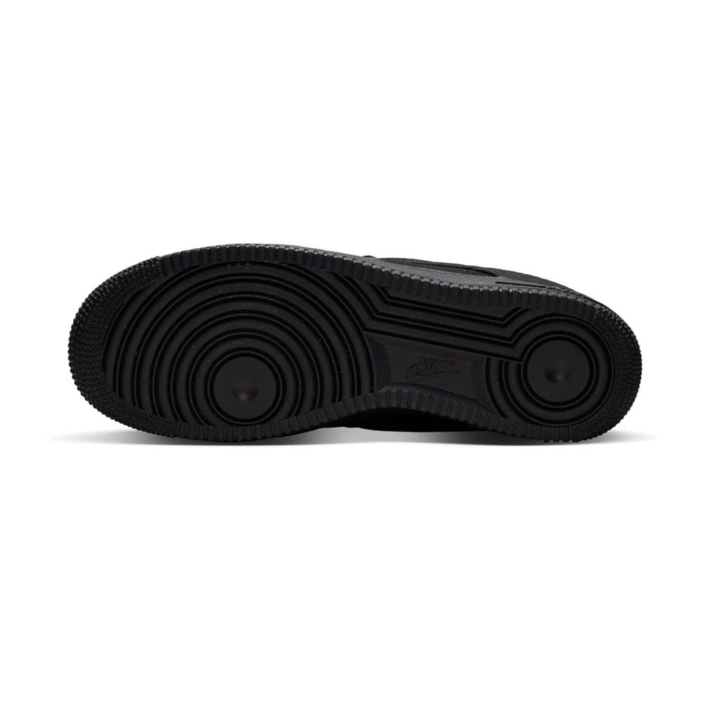 Black Nike Air Force 1 sneakers, outsole tread view