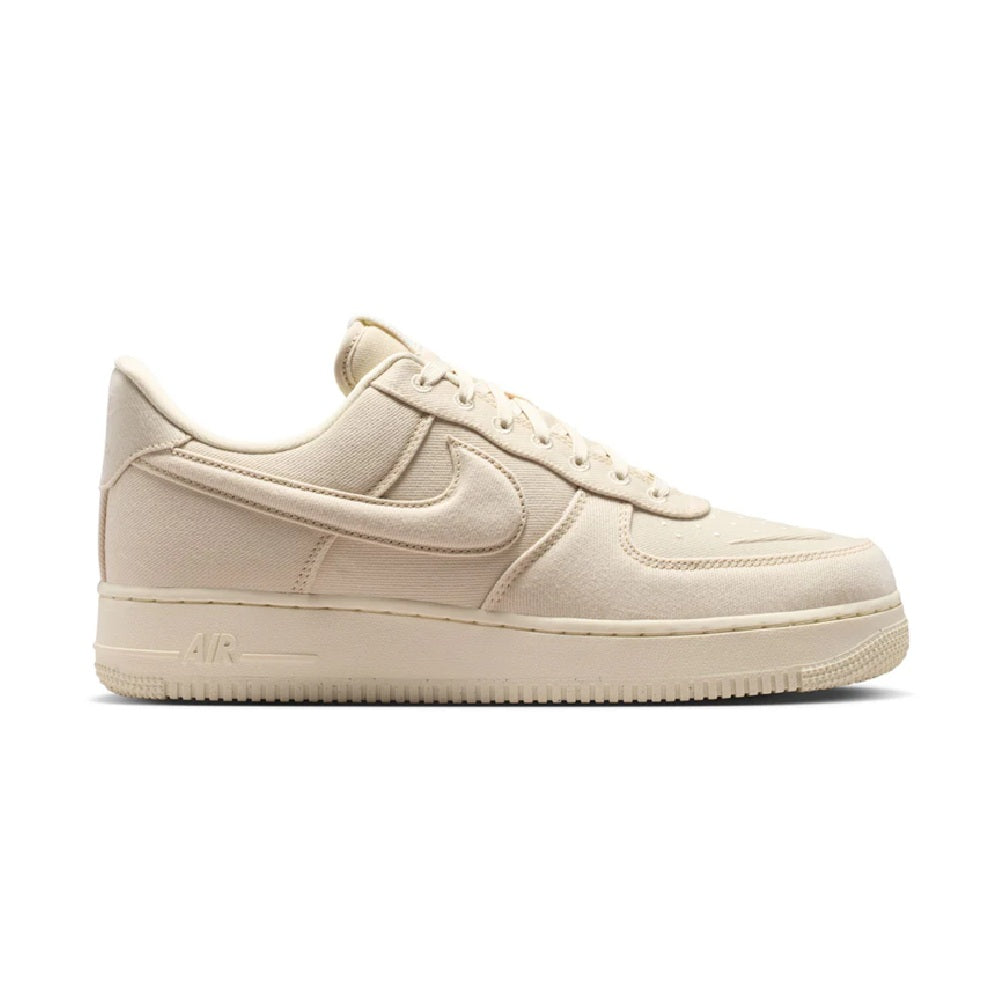 Beige Nike Air Force 1 low-top sneaker with side swoosh and lace-up front