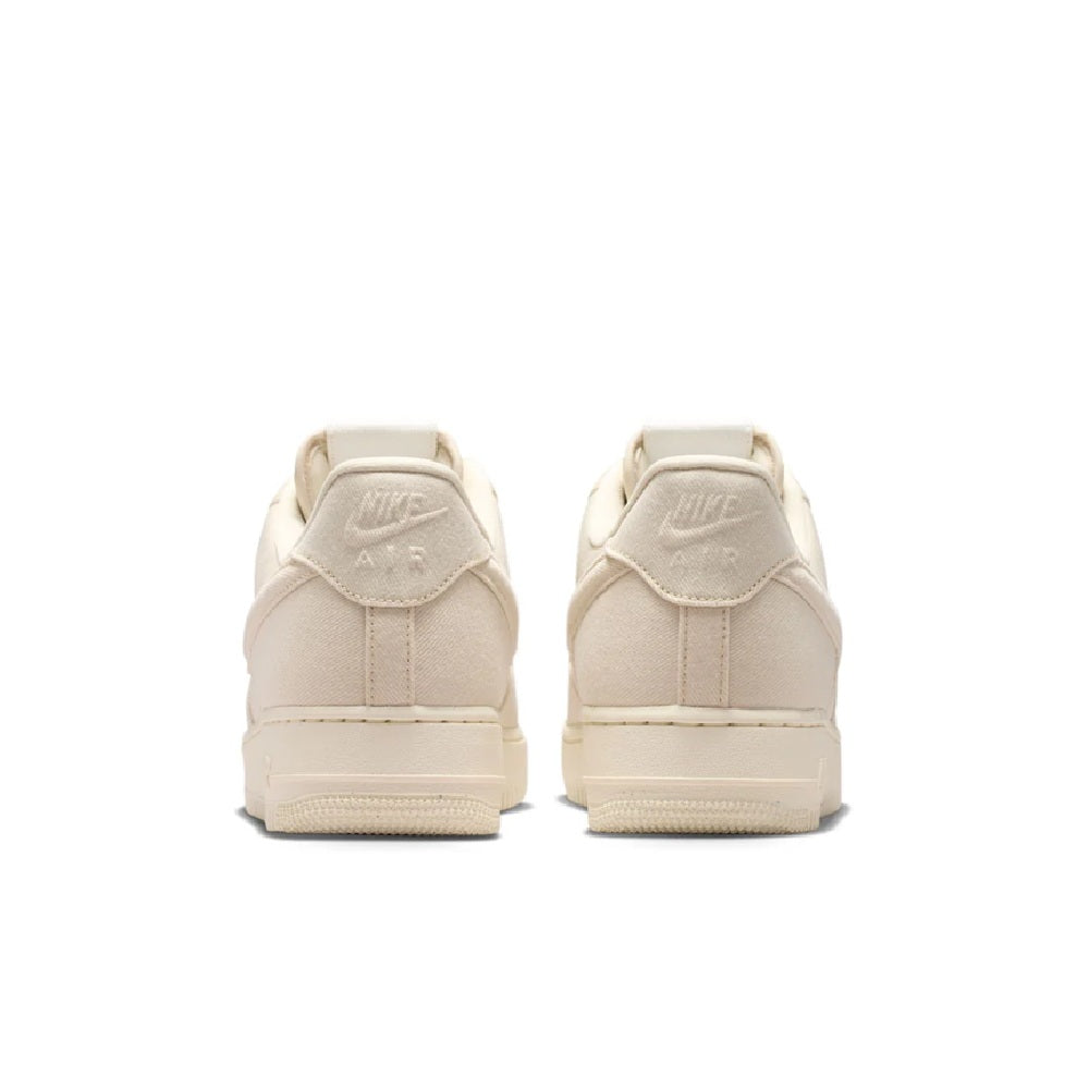 Beige Nike Air Force 1 low-top sneakers showing padded heel and pull tab
