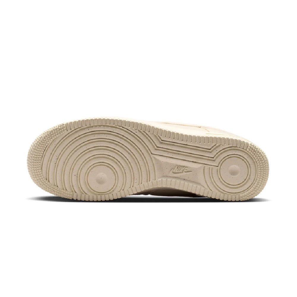 Beige Nike Air Force 1 outsole view with circular tread pattern