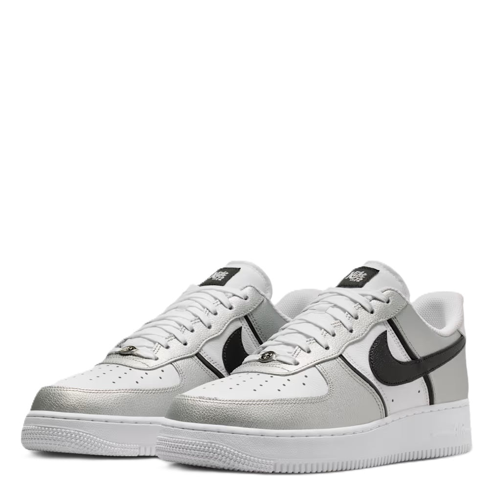 Pair of Nike Air Force 1 low-top sneakers, metallic silver with black accents