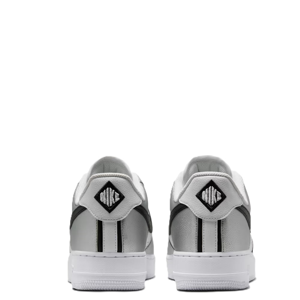 Nike Air Force 1 heel view, metallic silver with black-striped collar and white sole