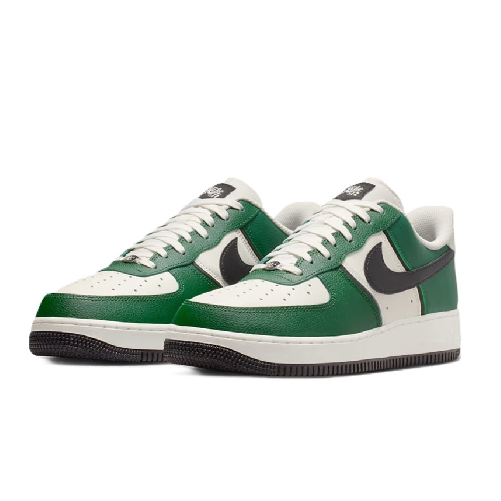 Pair of men's low-top Nike sneakers, green and white uppers with black swooshes