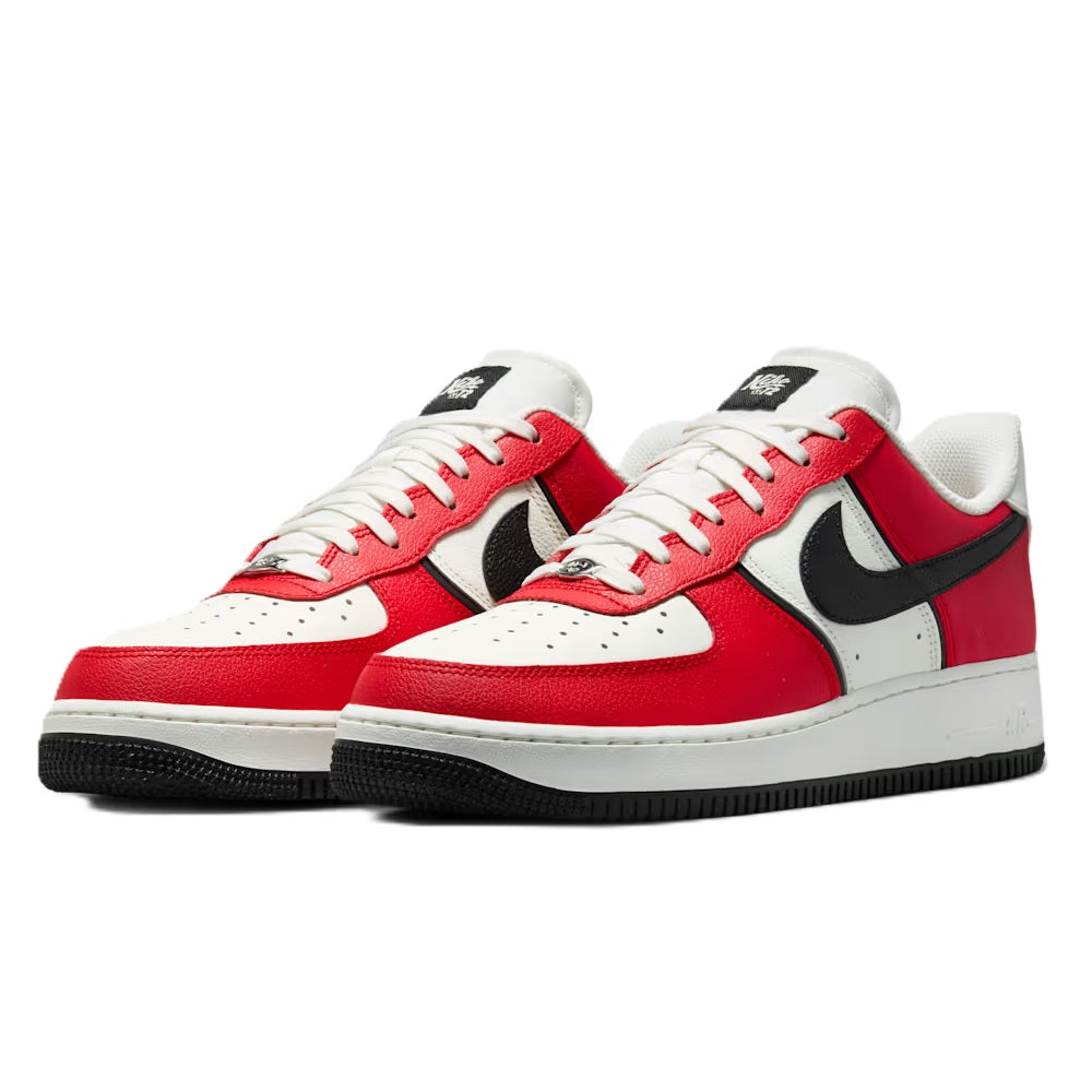 Red, black, and white Nike low-top sneakers, front view with lace-up details.