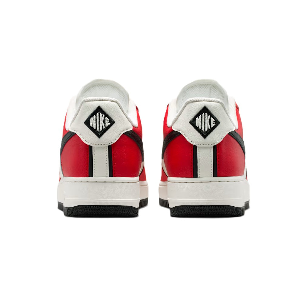 Red and white Nike sneakers with black heel tab, showing back lace-up view.
