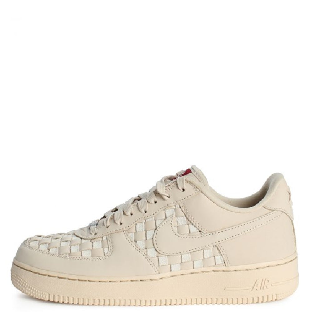 Nike Air Force 1 Low PRM sneaker in pale sand, side profile with braided detail