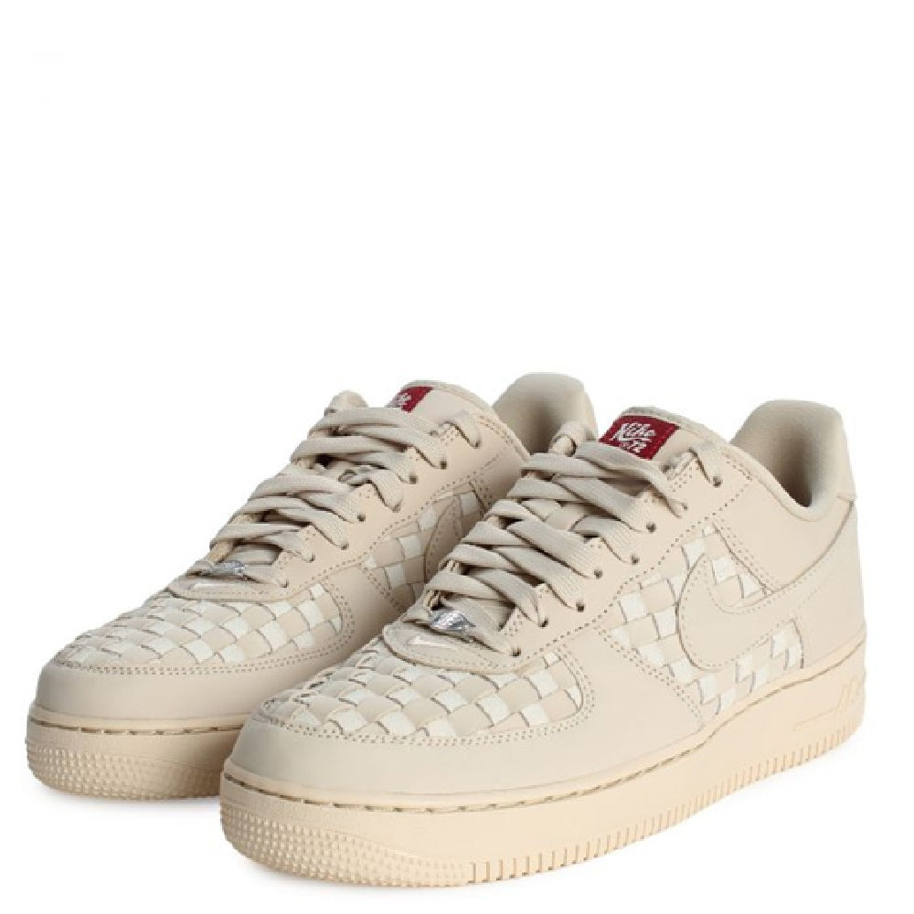 Nike Air Force 1 Low PRM sneakers in pale sand with red tongue labels
