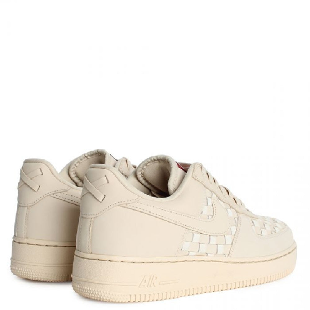 Nike Air Force 1 Low PRM sneakers in pale sand, rear and side view