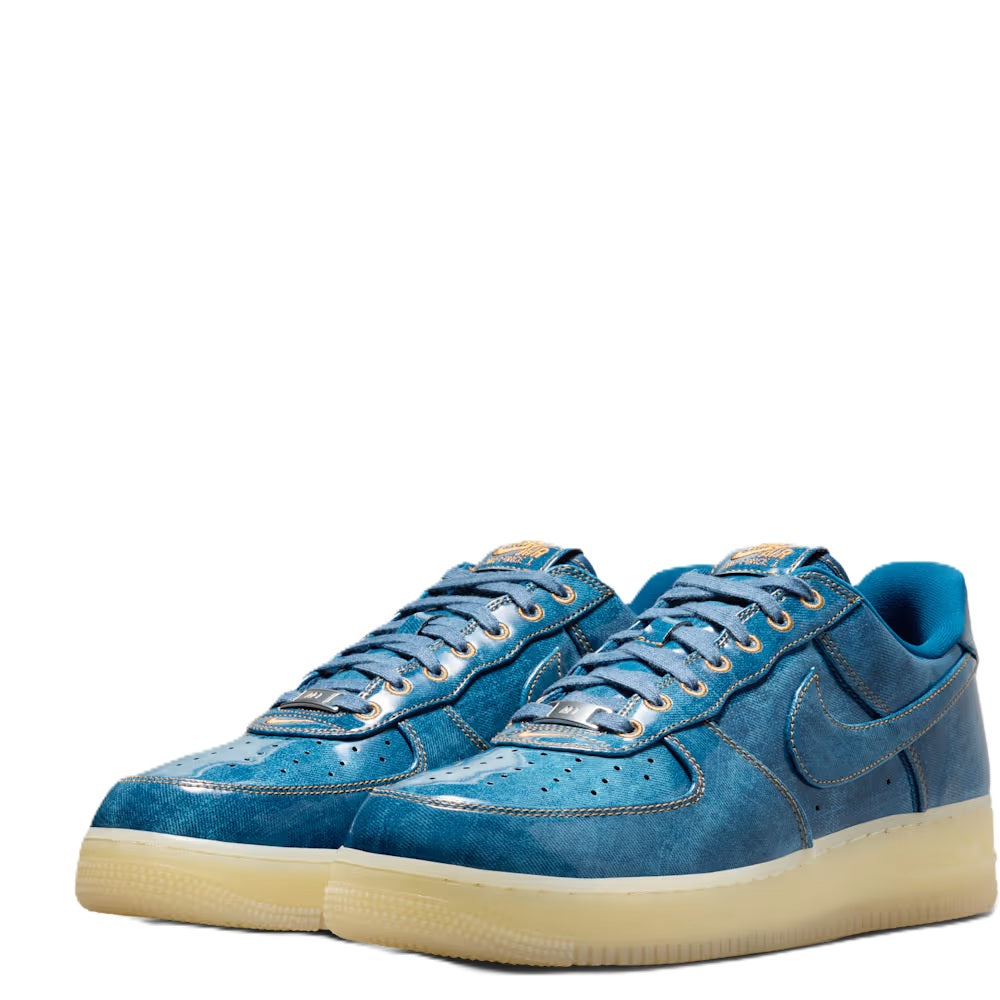 Pair of coastal blue Nike Air Force 1 low-top sneakers with gum soles