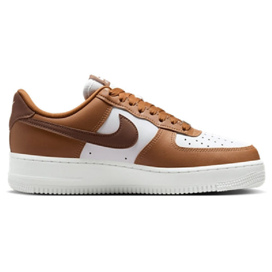Brown and white low-top sneakers with tan laces, Nike swoosh, and Air branding
