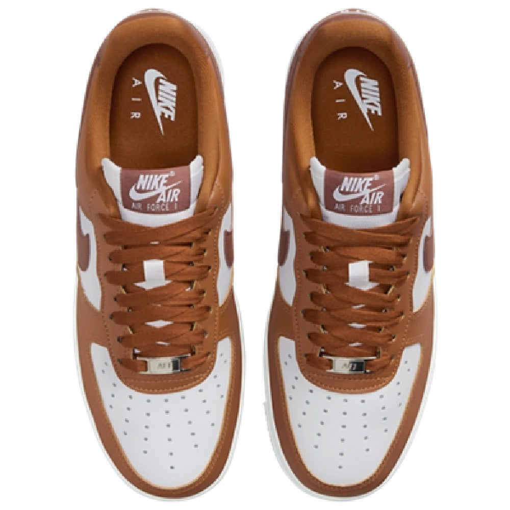 Pair of tan sneakers with brown laces and Nike Air tongue label