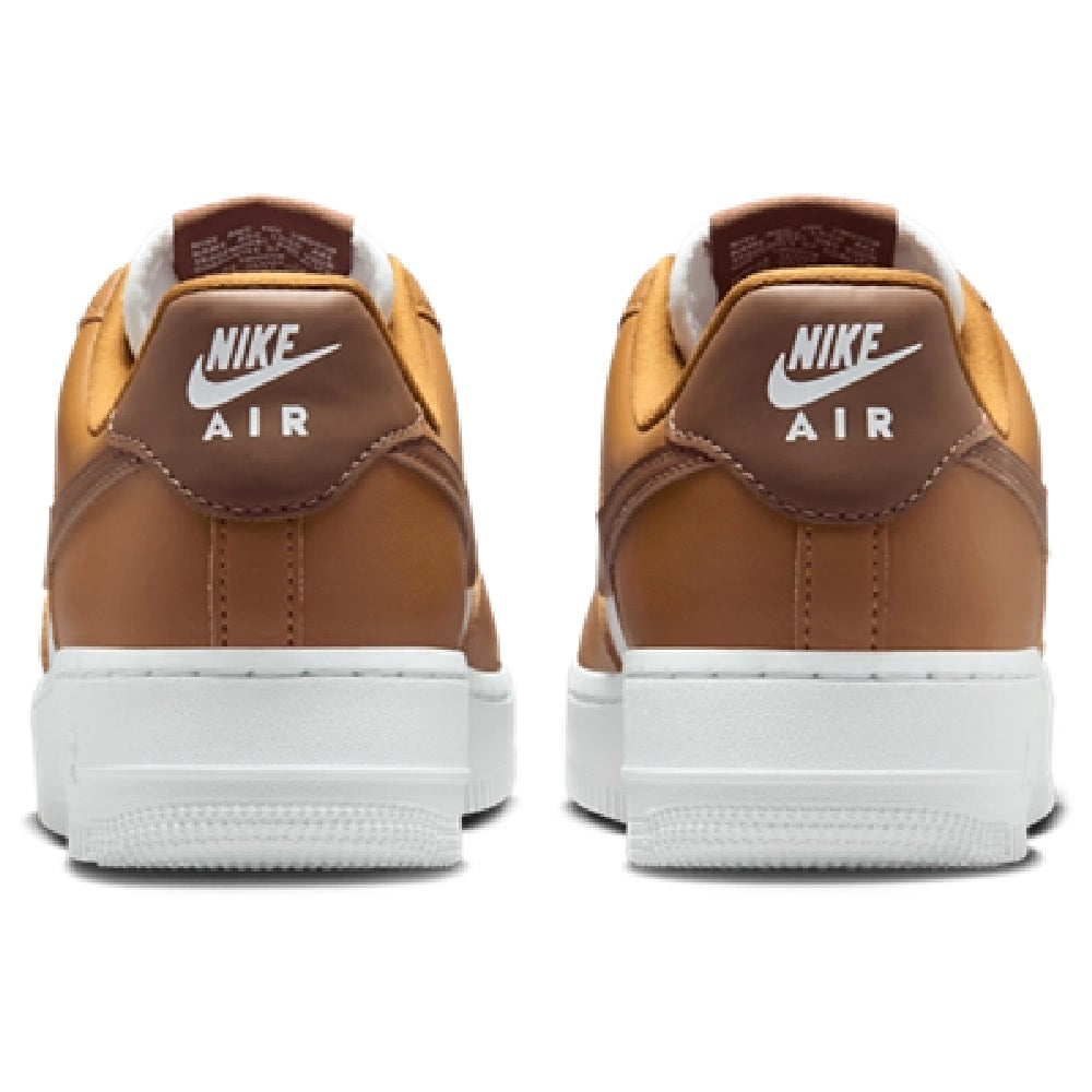 Brown sneakers with white midsole and Nike Air heel tab branding