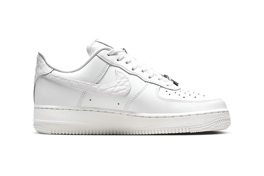 White Nike Air Force 1 low-top sneaker, lace-up, Swoosh on side, rubber outsole