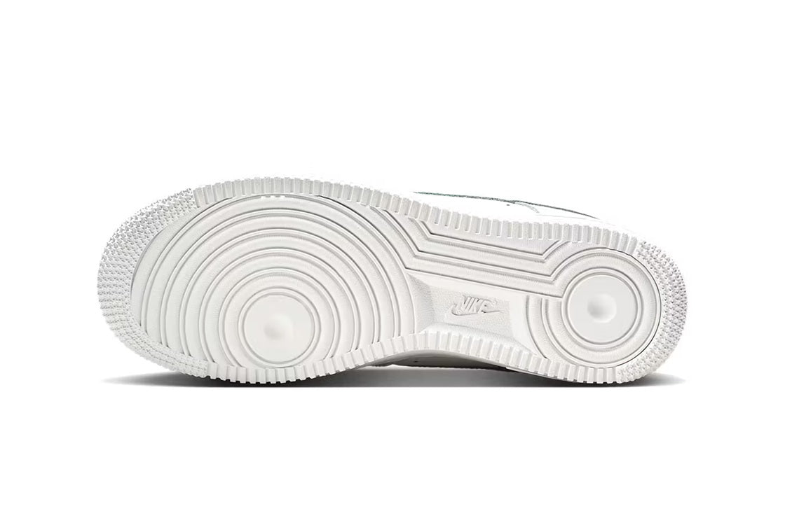 White Nike Air Force 1 outsole tread showing grooves and circular traction pattern