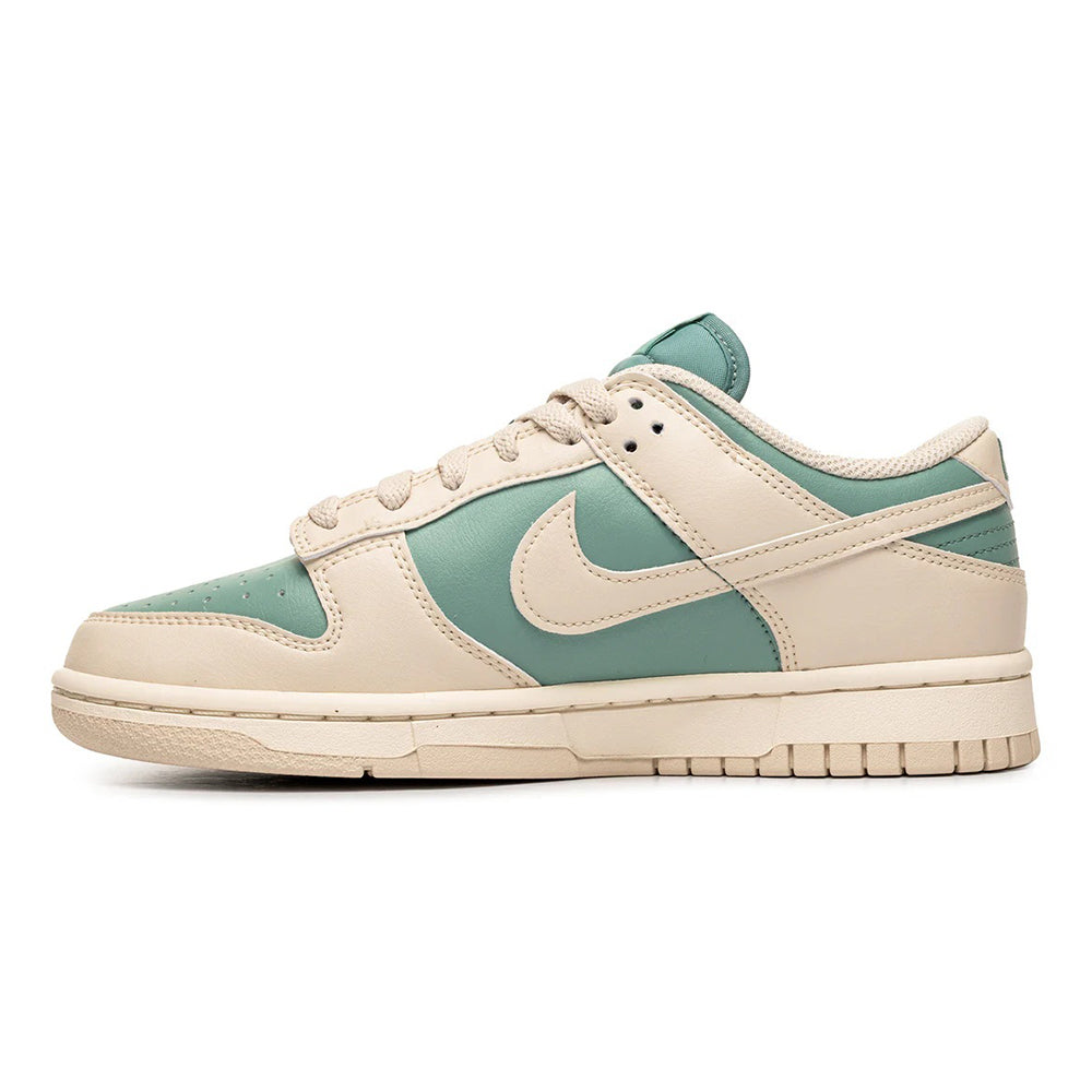Nike Dunk Low sneakers in off-white and mint green, low top lace-up.