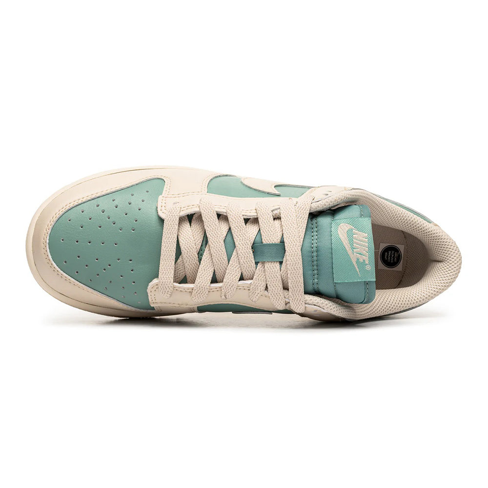Nike Dunk Low toe view with lace-up, mint tongue detail, off-white overlays.