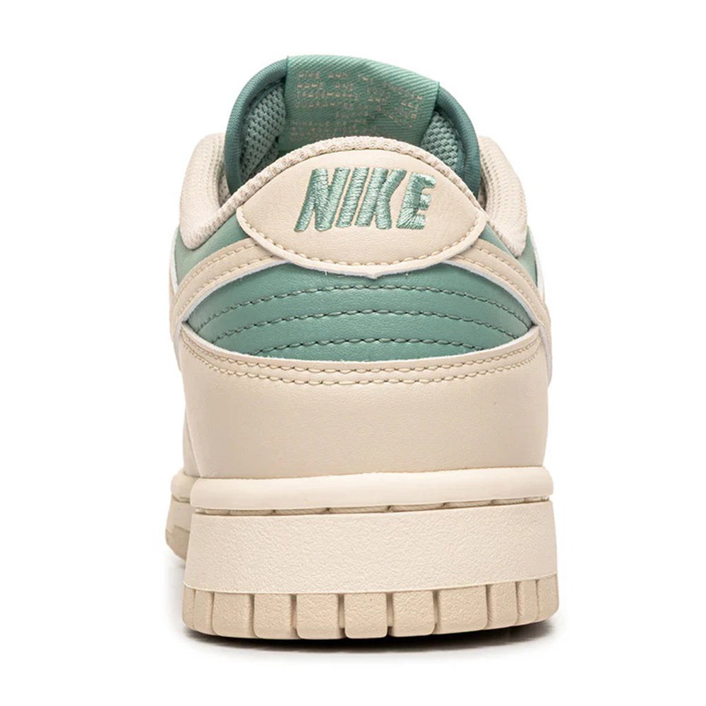 Nike Dunk Low heel view with mint collar and off-white back panel, lace-up.