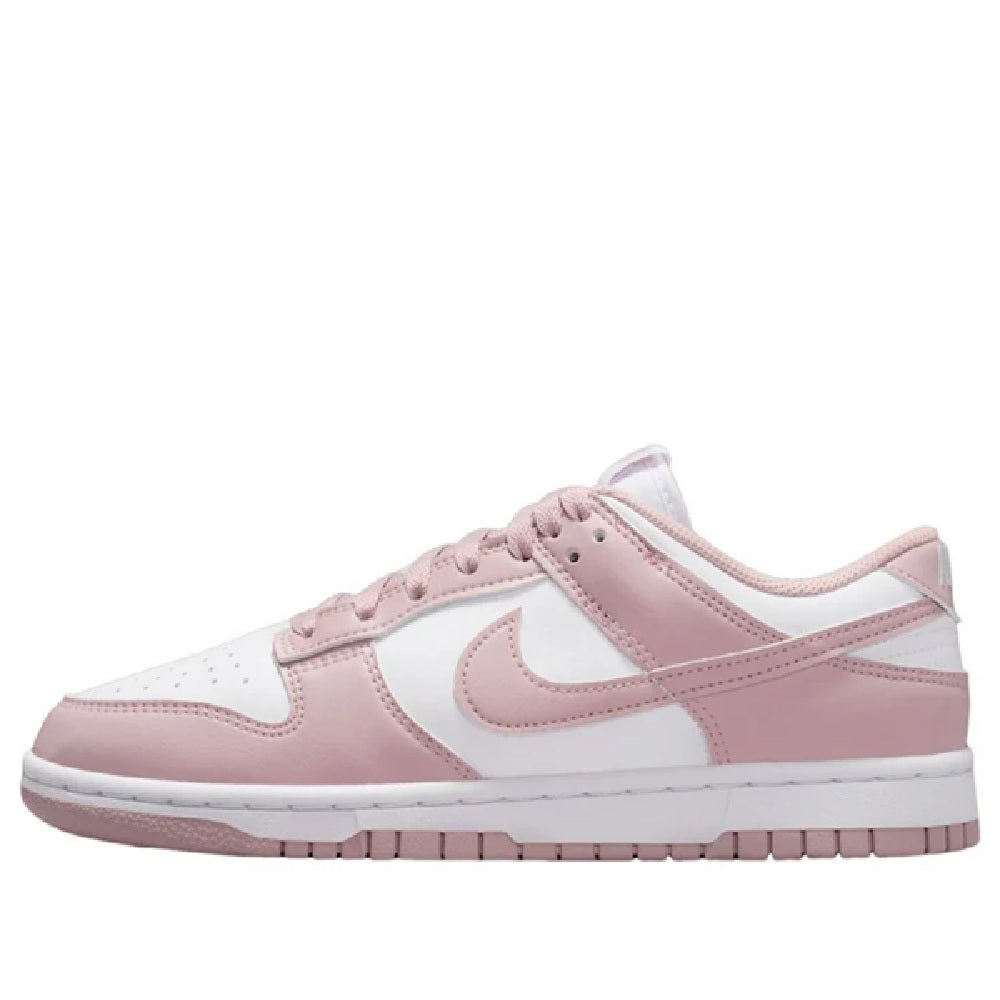 Women’s Nike Dunk Low sneakers in white and pale pink, low-top with pink swoosh