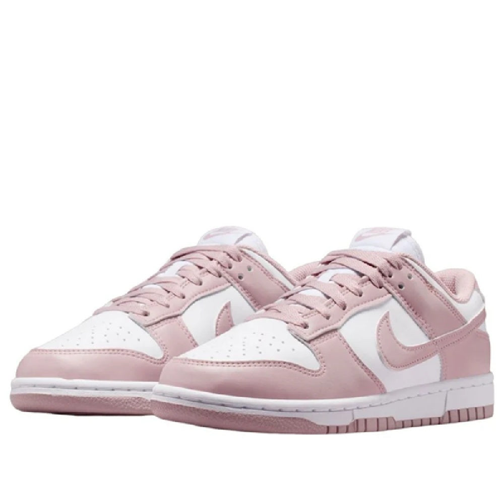 Pair of Nike Dunk Low sneakers with pink laces and layered white-and-pink panels