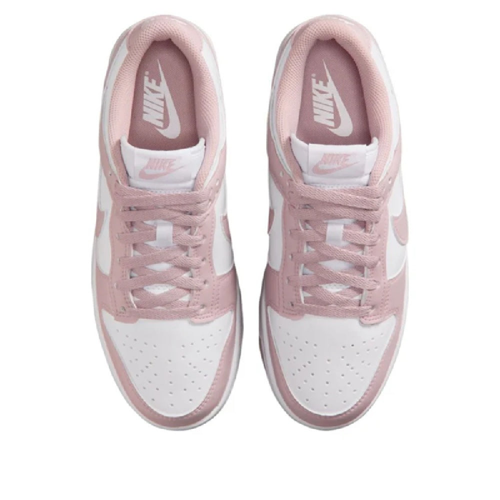 Nike Dunk Low sneakers with pink tongue lining and white outsole, front view