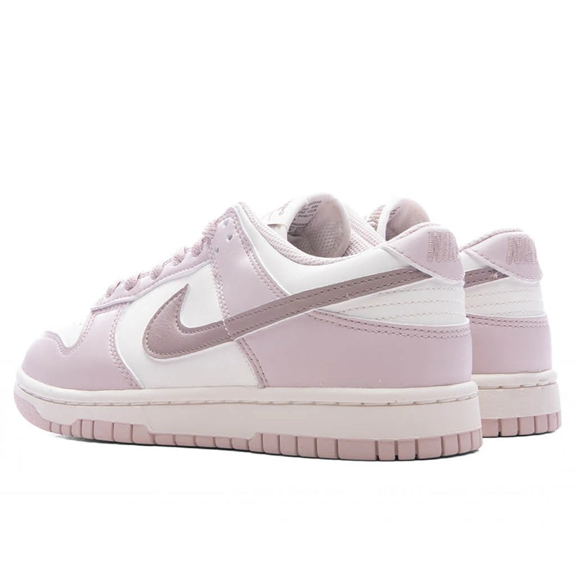 Low-top Nike sneakers, rear and side view with padded collar and pink heel panel.