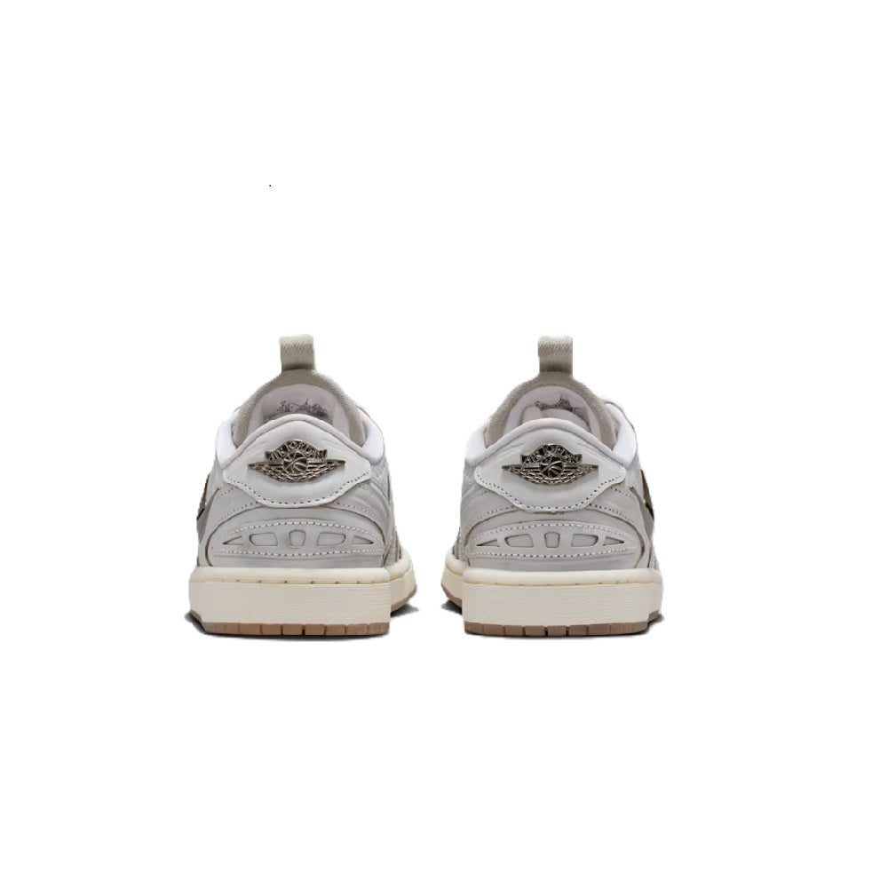 White low-top sneakers with heel tabs and rear detail; lace-up design