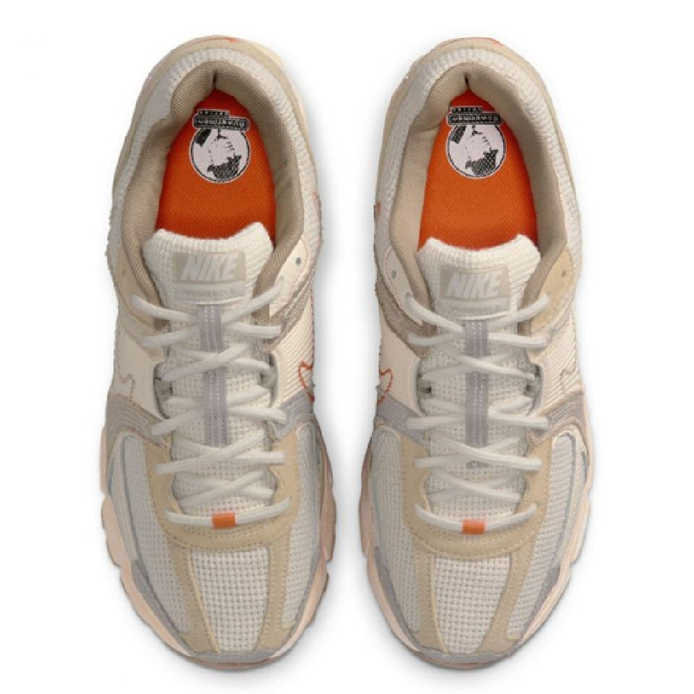 Nike Zoom Vomero 5 LT sneakers with white laces and orange heel lining