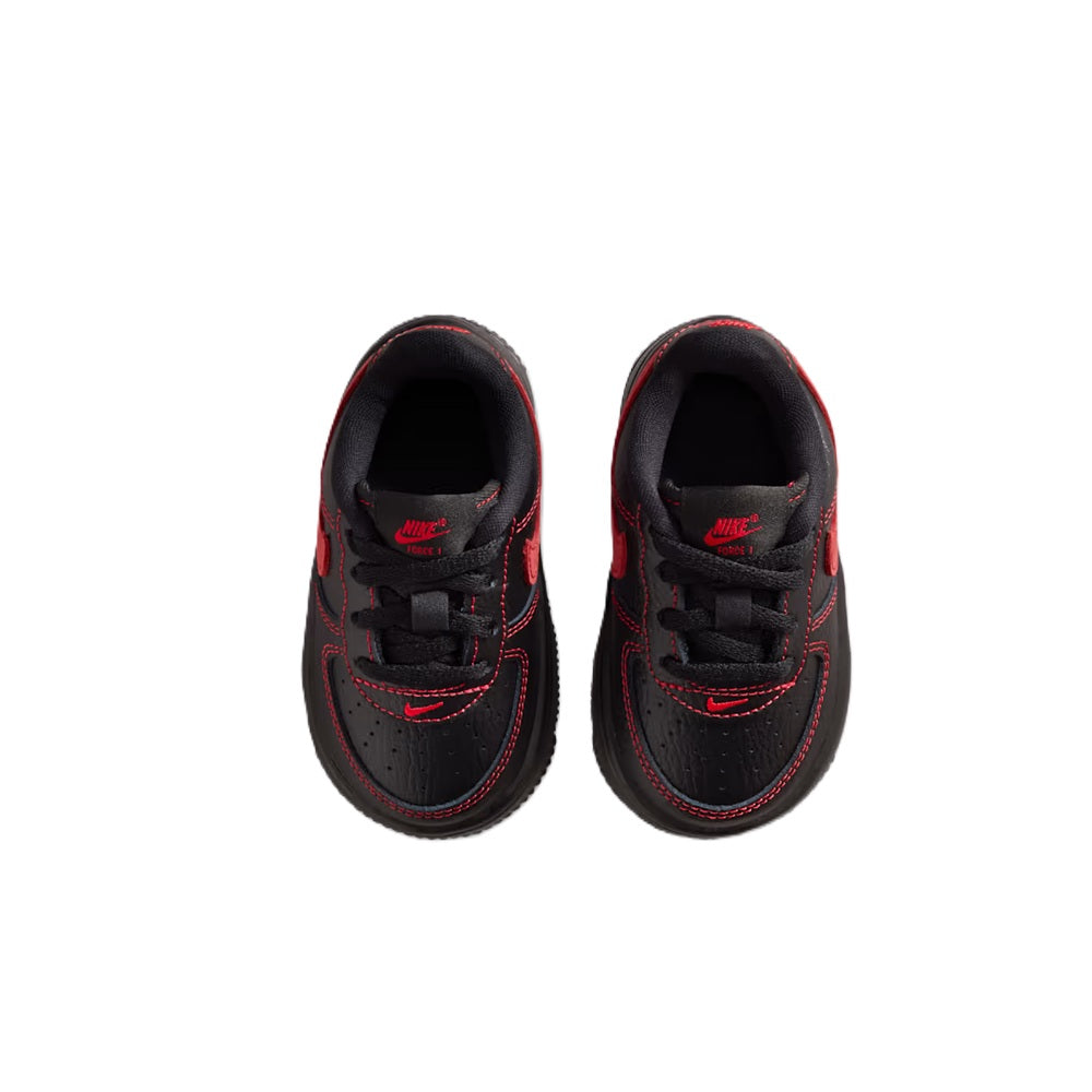 Toddler lace-up sneakers with black uppers and red stitched trim; front view.