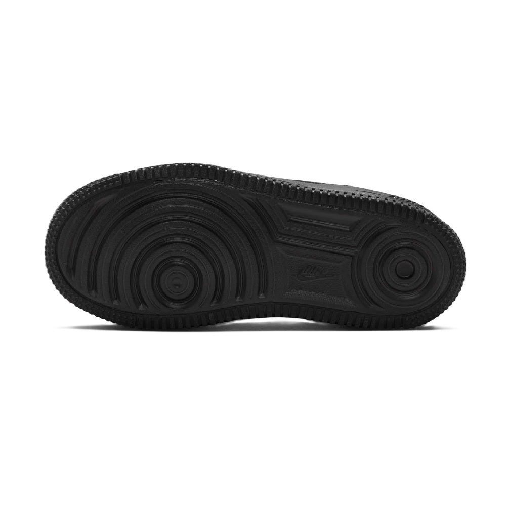 Black rubber outsole with circular traction tread for kids' Nike Force 1