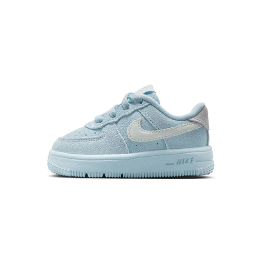 Toddler low-top lace sneakers in light blue with white Nike swoosh and blue sole