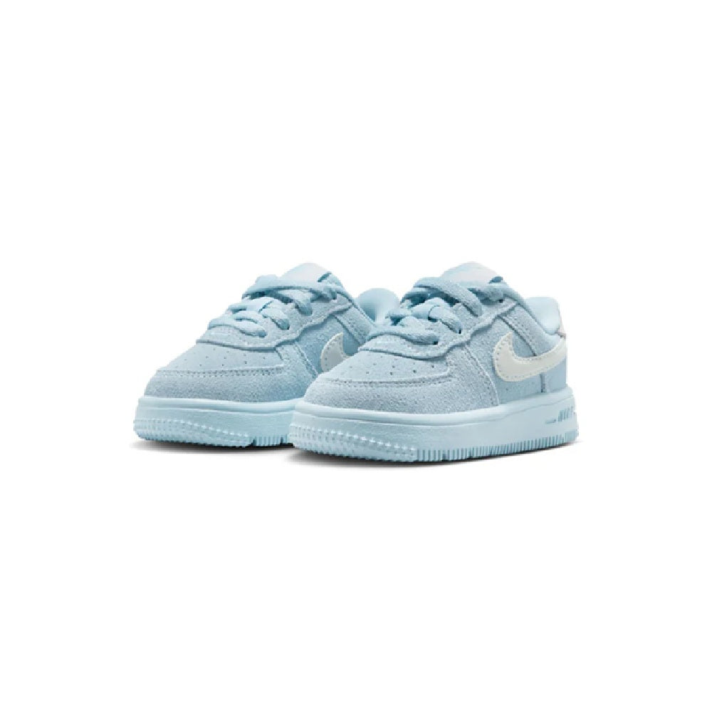 Pair of toddler light blue low-top lace sneakers with white swoosh and blue outsole