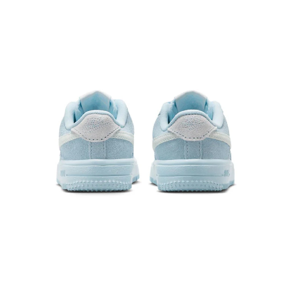 Toddler light blue low-top sneakers, rear view with padded collar and blue tread sole