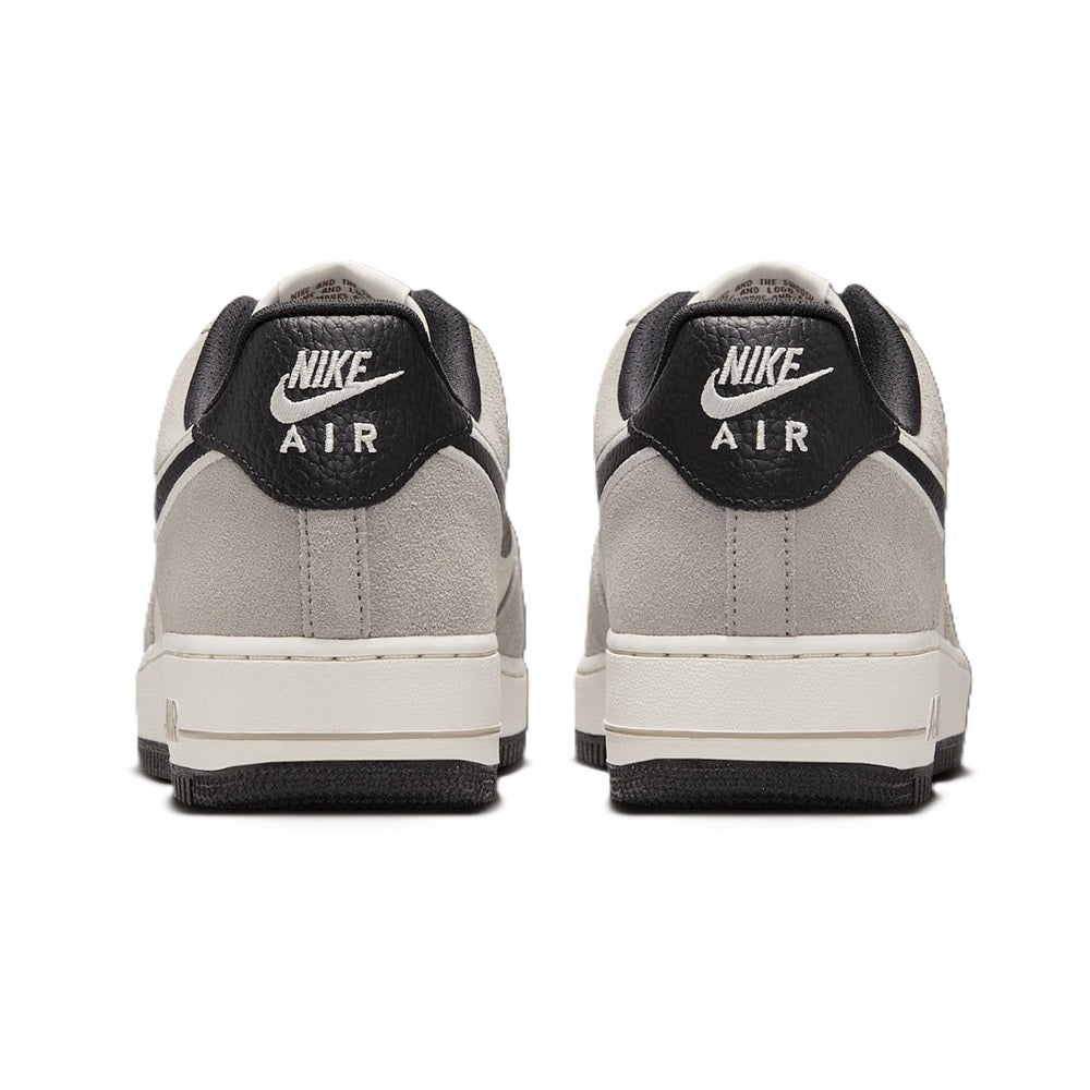 Men's Nike Air Force 1 low-top sneakers, heel view with black collar and light gray panels