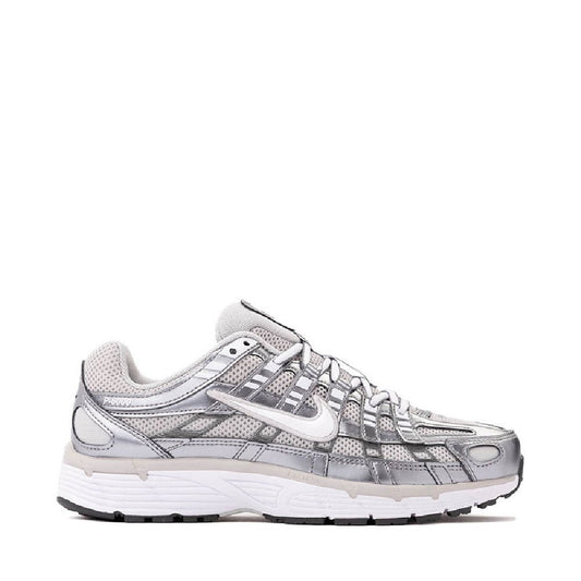 Women's Nike P-6000 running sneaker in grey with white accents and perforated panels