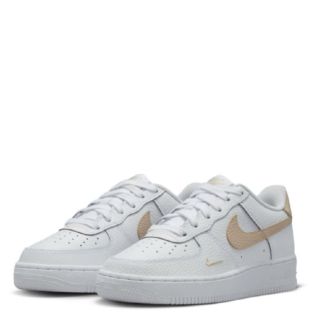 Big kid Nike Air Force 1 sneakers, pair shot in white with tan Swoosh accents