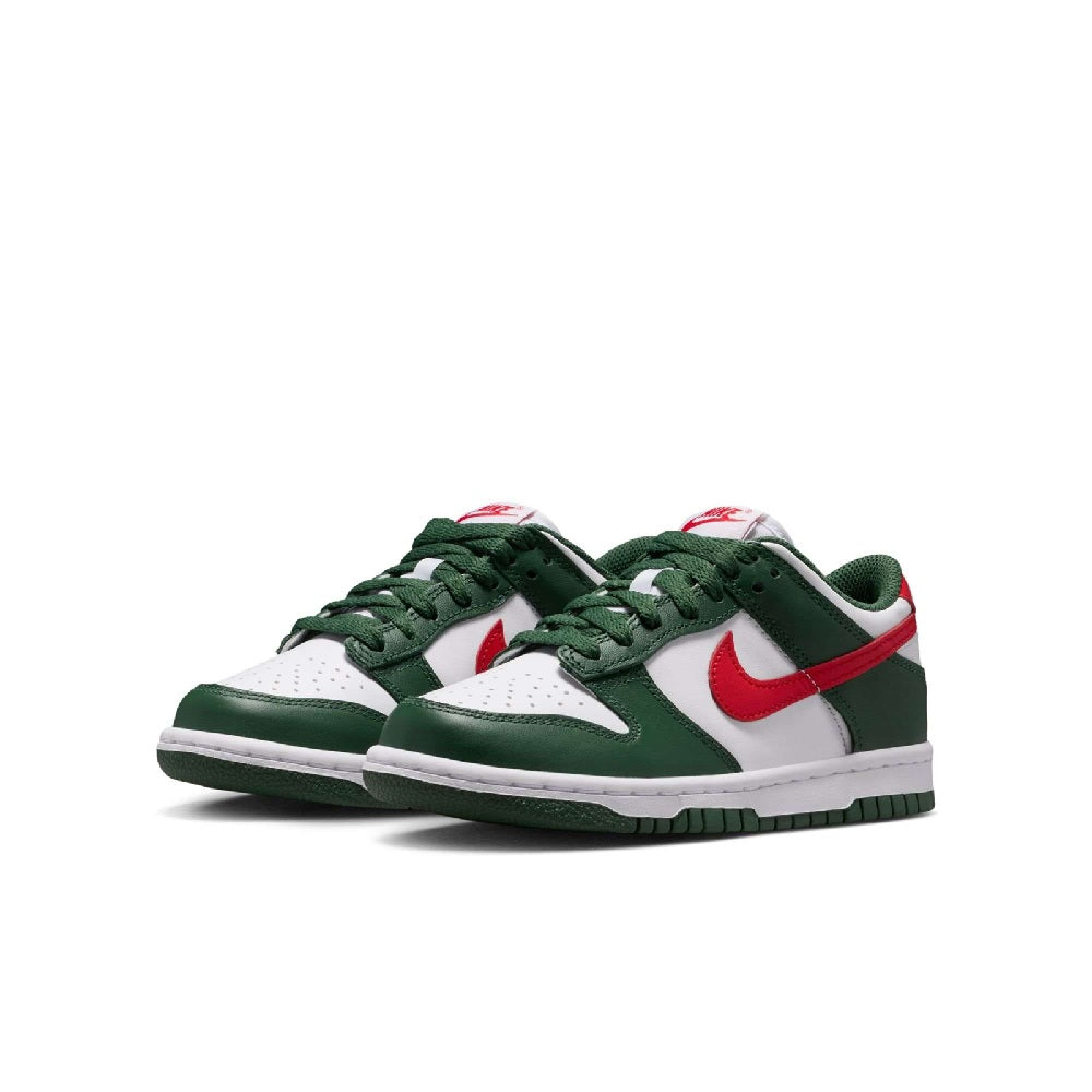 Kids' Nike Dunk Low sneakers showing front toe box, green and white with red accents