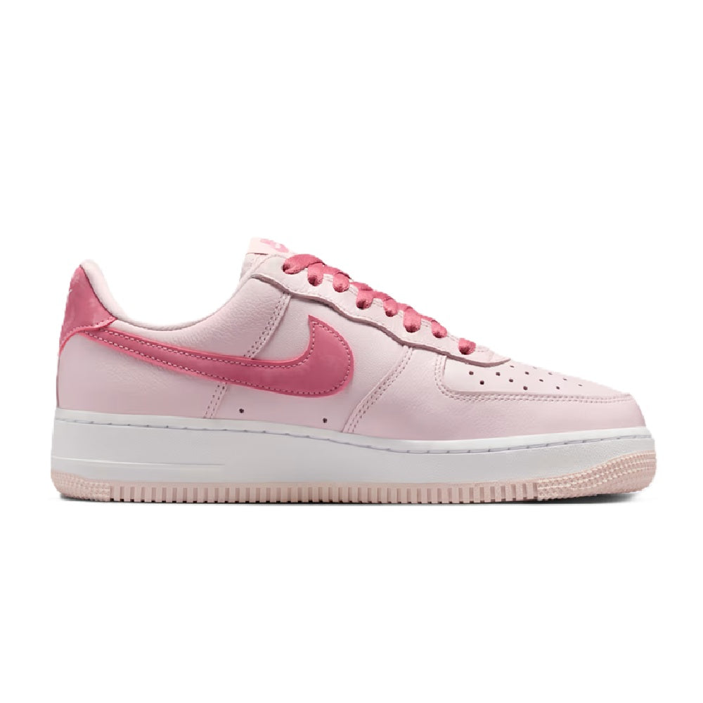 Women’s Nike Air Force 1 low-top sneakers, pale pink with pink swoosh, side profile