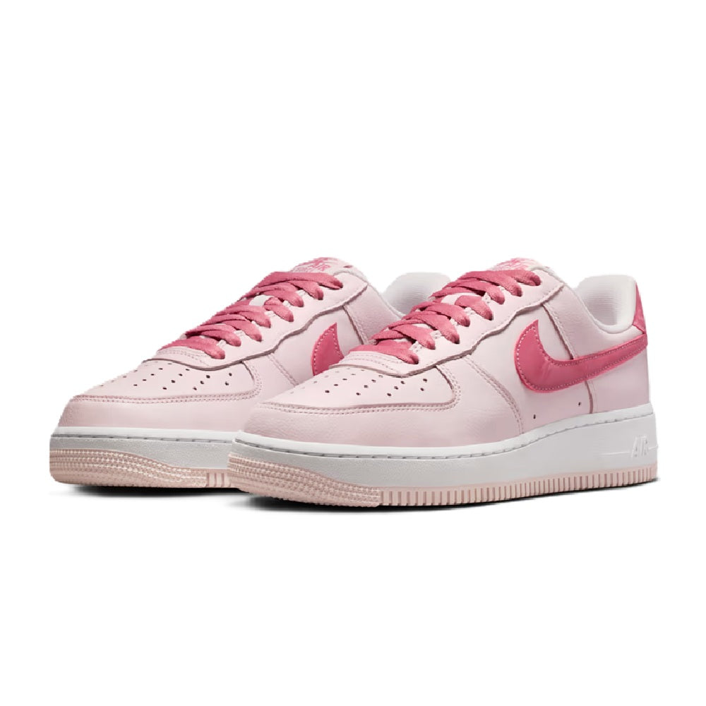 Pair of Women’s Nike Air Force 1 low-top sneakers, pale pink leather with pink laces