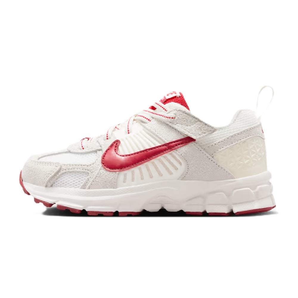 Kids' Nike Vomero 5 SE running sneaker with white upper and red swoosh, lace-up.