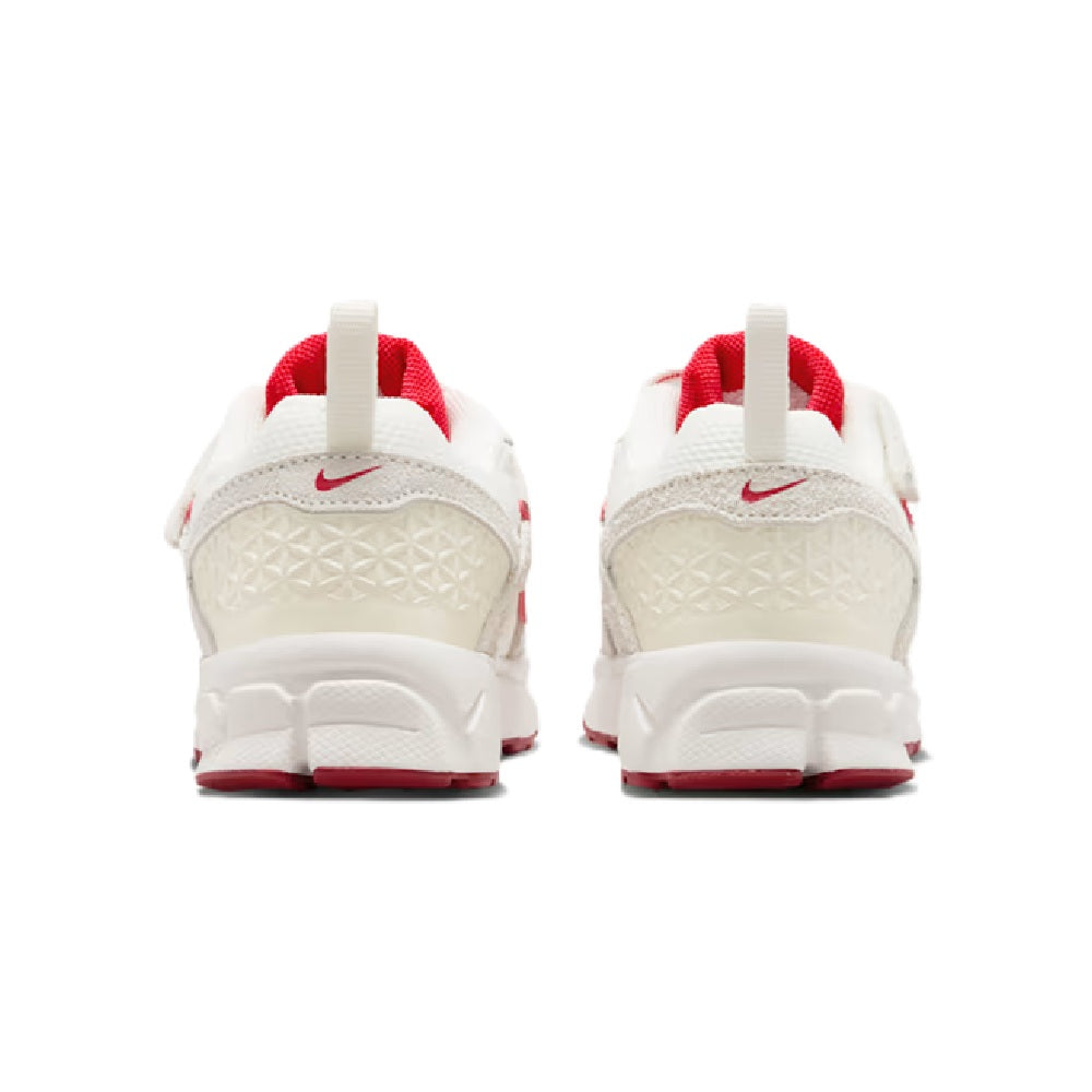 Kids' Nike Vomero 5 SE sneakers, rear view with red heel tabs and white cushioning.