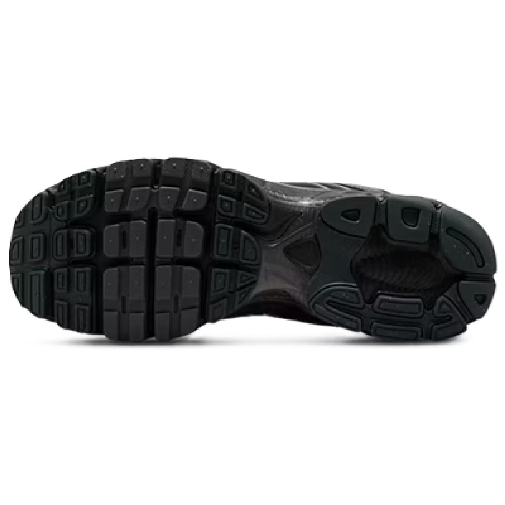Men's black rubber outsole view with tread pattern and cushioning unit