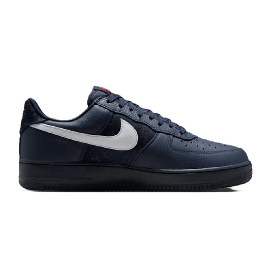 Navy low-top Nike Air Force 1 sneaker with white swoosh and lace-up design