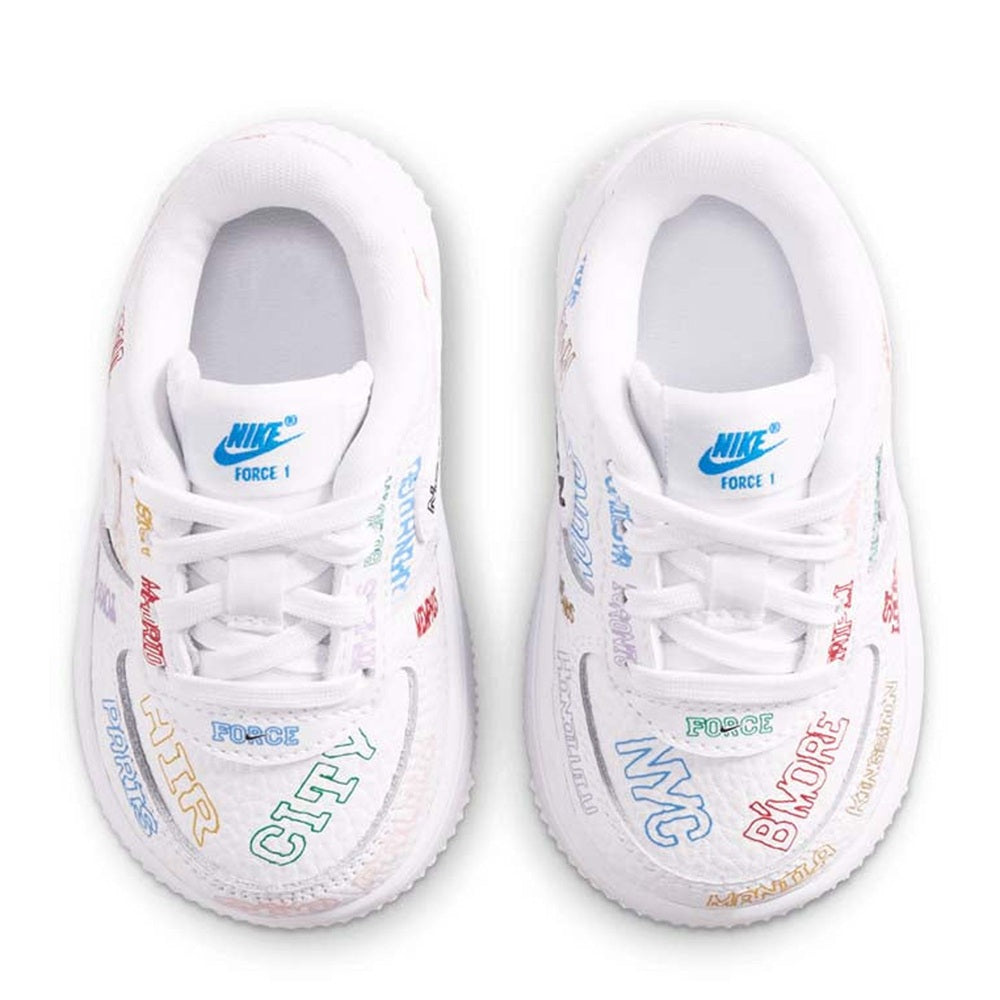 Toddler Nike Air Force 1 low-top sneakers, white laces and padded tongue close-up.