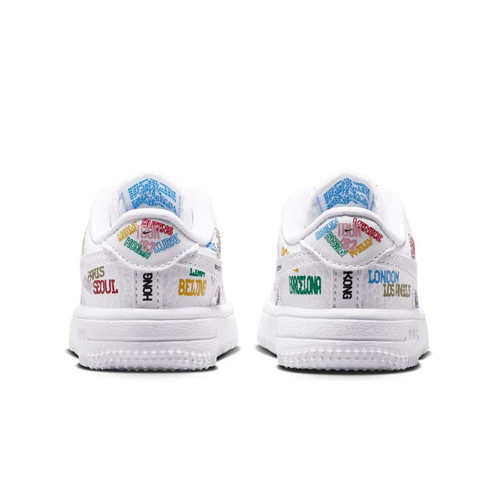 Toddler Nike Air Force 1 low-top sneakers, white heel with city-text panels.